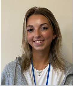 Staff Member in Gray Sweatshirt with Blue Lanyard